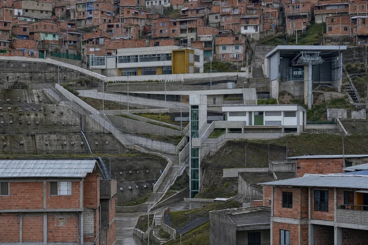 Long-lens view of civic terraces connecting a steep housing district.