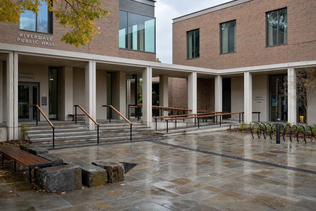 Second accepted render of the same courtyard from the same square viewpoint in early-autumn daylight.