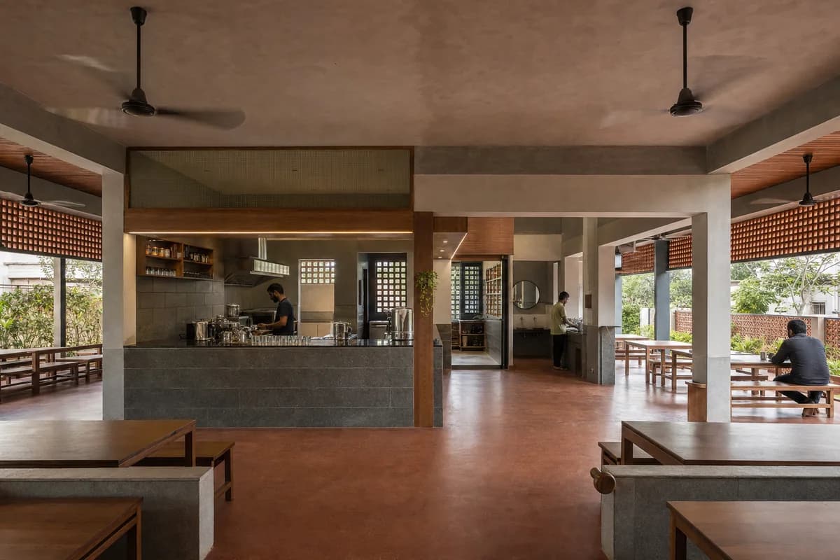 Community Tea Veranda, neighborhood tea room organized by a shaded veranda wrapping a clear service and wash core.