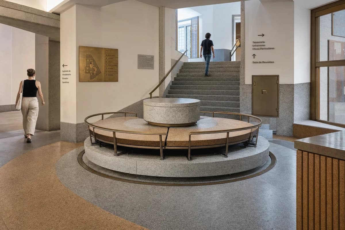 Granite Pivot Seat, furniture shaping public foyer with a rotating stone seat.