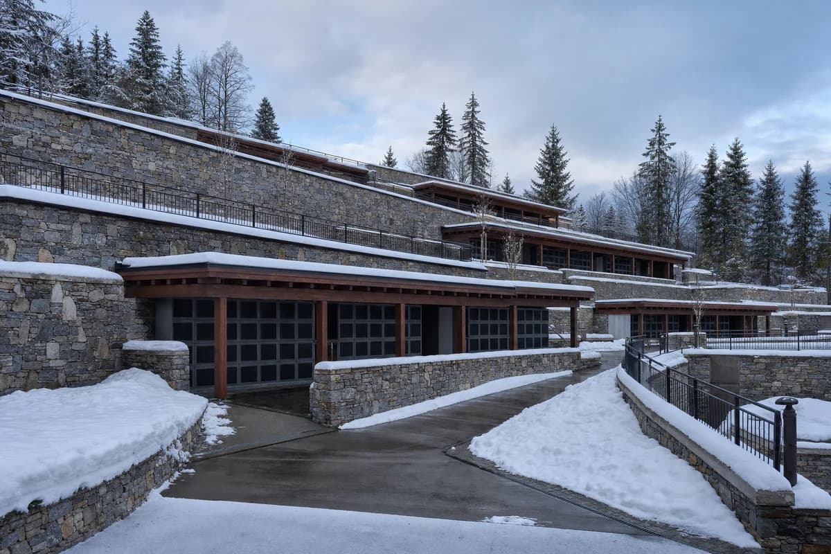 Stone hillside columbarium terraces clarified by fresh morning snow.