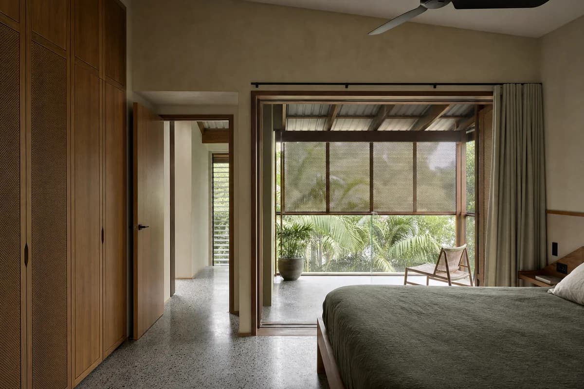 Garden-Screen Bedroom, subtropical-house bedroom organized by a sleeping room opening to a screened roofed garden threshold.