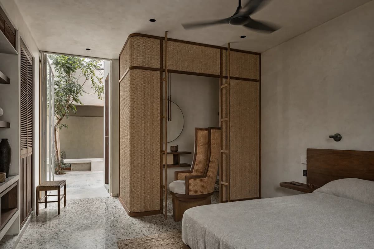 Woven Privacy Chair, furniture shaping bedroom with a high-backed chair.