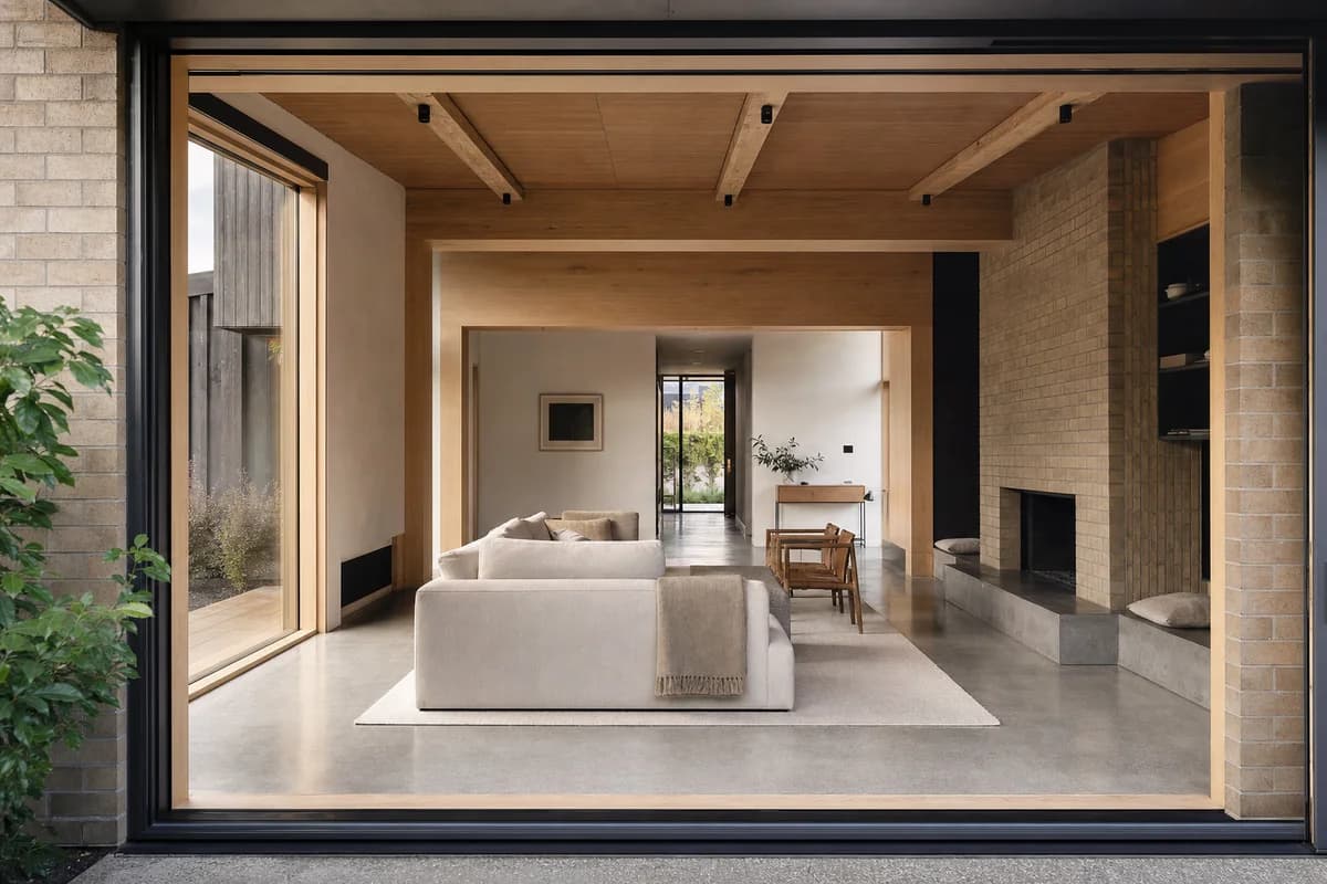 Garden Threshold Hall, family living room organized by an expressed frame spanning between sheltered garden rooms.