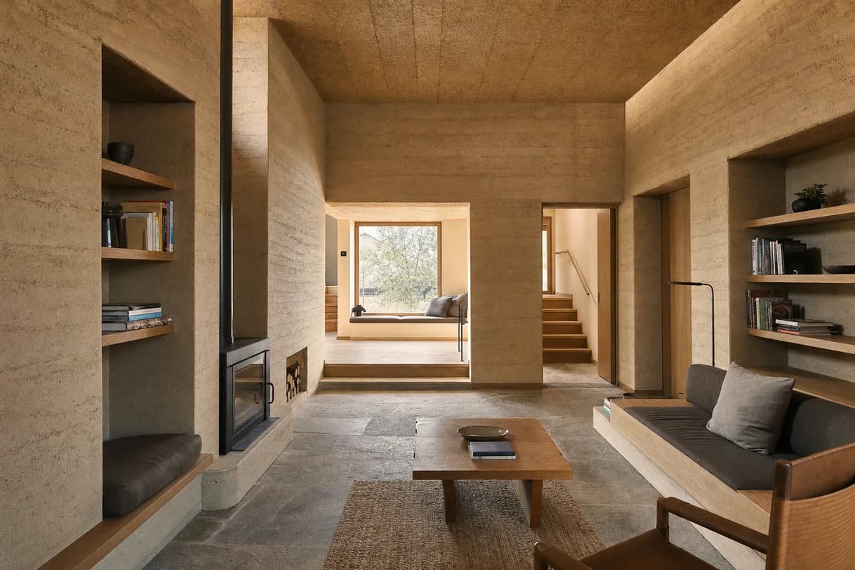 Thick-Wall Reading Room, earth-house living room organized by inhabitable wall niches surrounding a low central room.