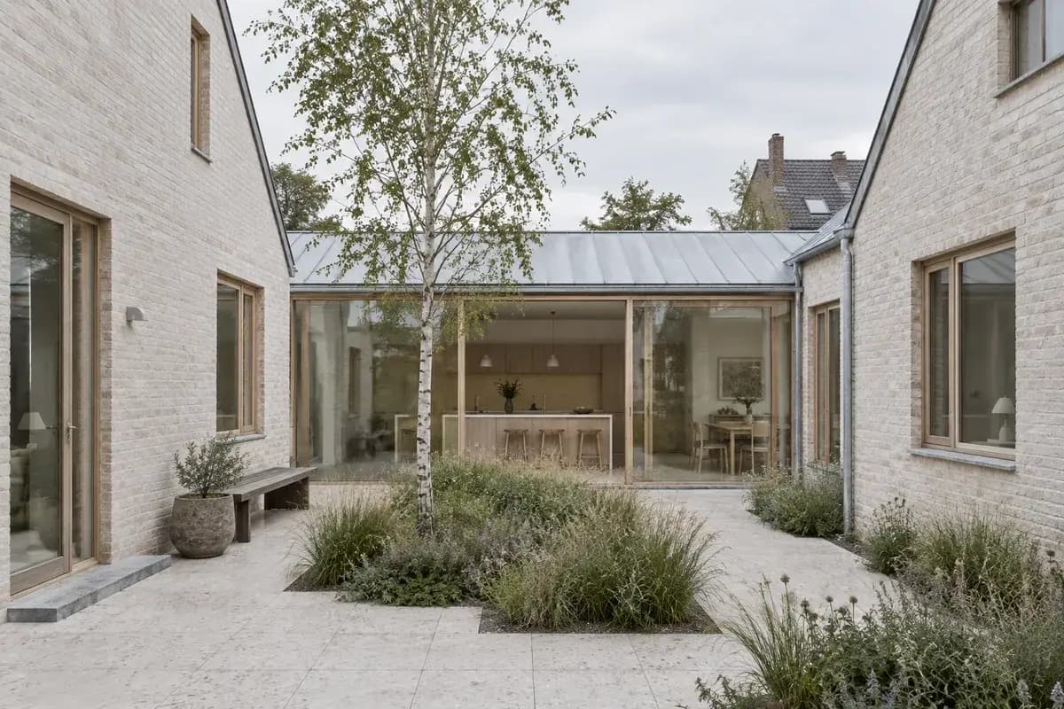 Daylight GPT Image 2.5 Flare render of a pale brick courtyard house