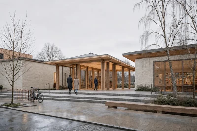 The library court with three people focused at the entrance threshold