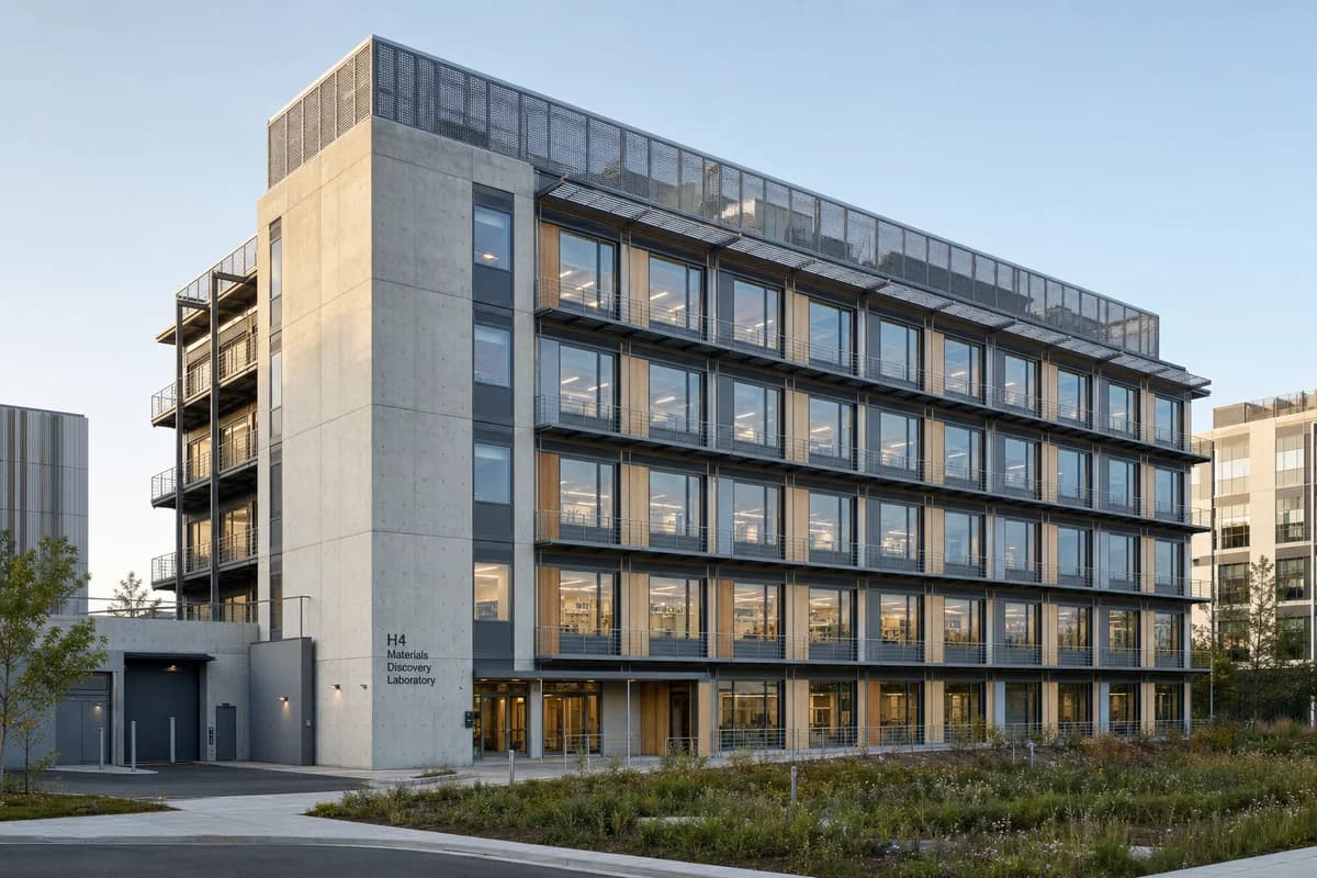 Unoccupied modular research building with visible shading, maintenance walks, and planted bioswales.