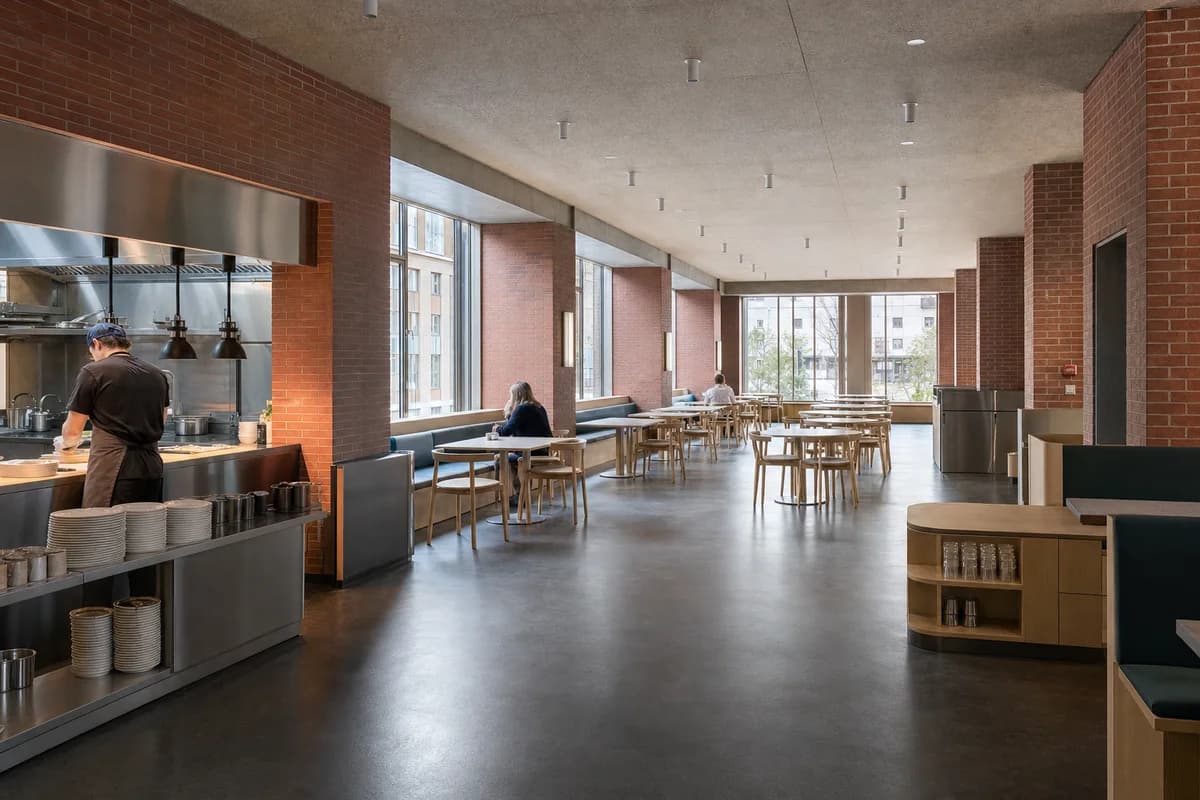 Northlight Lunch Hall, daytime eatery organized by shared dining organized by deep window bays and clear return routes.