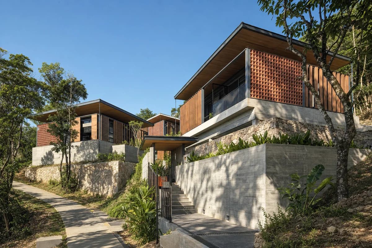 Unoccupied Da Nang hillside home under a clear blue sky with bright direct sunlight and crisp terrace shadows.